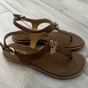 Michael Kors Brown Sandals with Ankle Strap and Gold Charm